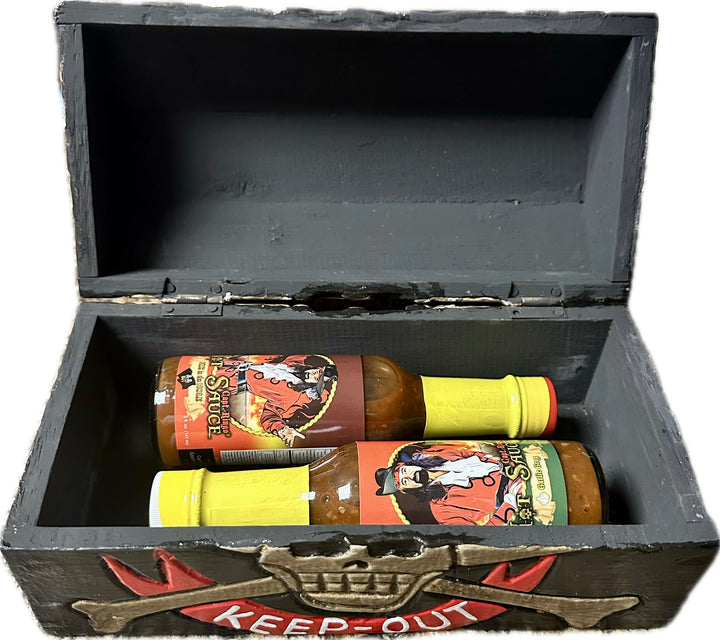 2 bottles of sauce in a real wood treasure chest